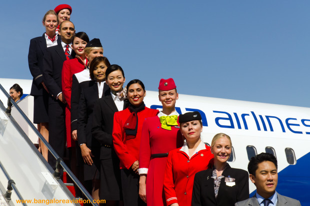 Uniformed cabin crew representatives from each of the oneworld member airlines standing top to bottom of the stairs in alphabetical order. AirBerlin, American Airlines, Cathay Pacific, Finnair, Iberia, Japan Airlines, LAN Chile, QANTAS, Royal Jordanian, S7 Russian Airlines, and Malaysia Airlines. The Master or rather mistress of ceremonies kept referring to the crew as “girls” requesting them to line up, forgetting that British Airways was represented by Mr. Dave.