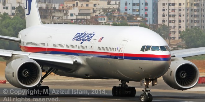 Malaysia Airlines Boeing 777-200ER registration 9M-MRO taken at Dhaka, Bangladesh on 11-Feb-2014. This aircraft went missing while performing flight MH370 from Kuala Lumpur to Beijing with 239 persons on board. Photo copyright M. Azizul Islam