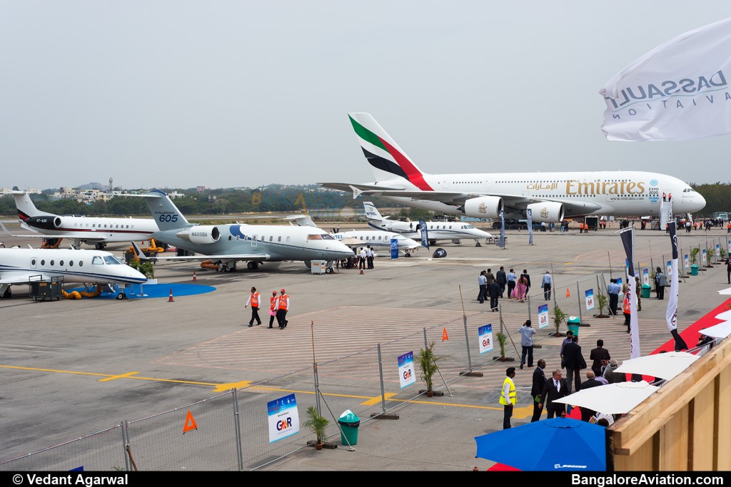 The ramp at India Aviation 2014, the small jets are flanked on one side my the massive Airbus A380 and on the other by the sleek Boeing 787-8.