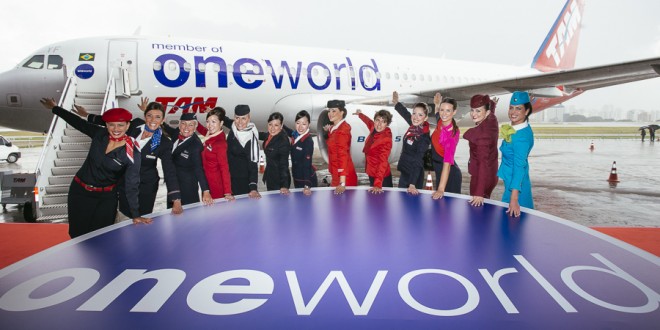 Representative cabin crew of the oneworld member airlines pose in front of TAM airlines A320