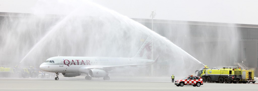 Qatar Airways A320 Sharklet A7-AHX First Flight to arrive at Hamad Intl Airport gets traditional water cannon salute from the HIA ARFF team.