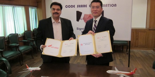 Mr Pankaj Srivastava, commercial director of Air India and Mr. Li Dianchun, commercial director of Hong Kong Airlines sign code-share agreement in Delhi. Photo courtesy the airlines.