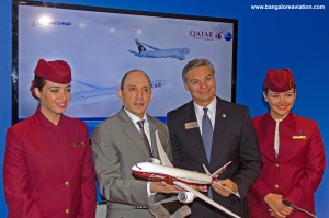 Akbar Al Baker, CEO, Qatar Airways poses with Ray Connor, President, Boeing Commercial Aircraft and Qatar air hostesses cabin crew after the 100 777-9X order signing ceremony at the Farnborough air show 2014.
