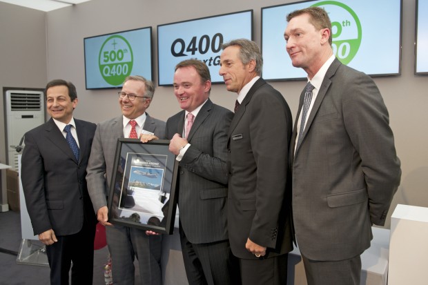 Senior Bombardier executives accept a plaque from Pratt & Whitney celebrating the 500th Q400 order.