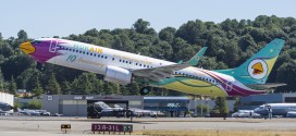 10th anniversary livery Nok Air 737-800 registration HS-DBO takes off from Seattle. Boeing image.