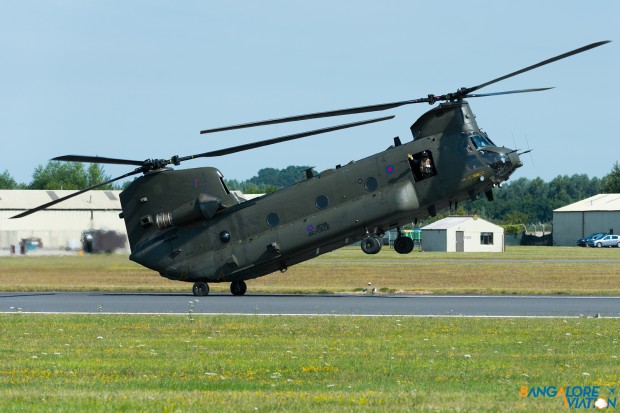 Royal Air Force Boeing CH-47 Chinook ZA714. Seen with one of the flight crew waving out of the door as the helicopter reverses down the runway.