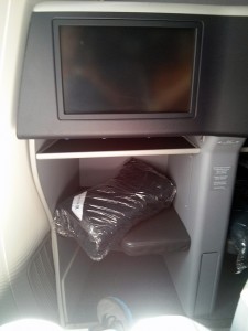 1A on the United Dreamliner. The little book shelf under the monitor is useful for storing flat items like the menu or an iPad or Kindle tablet or my eyeglasses while sleeping.