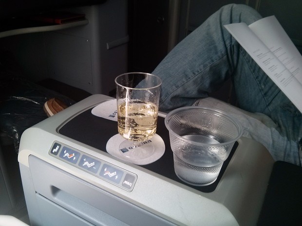 United Boeing 787-8 Dreamliner Business-First class. Compared to other airlines' business classes a plastic champagne and water glass look cheap. The seat controls are easy to access even while lying down.