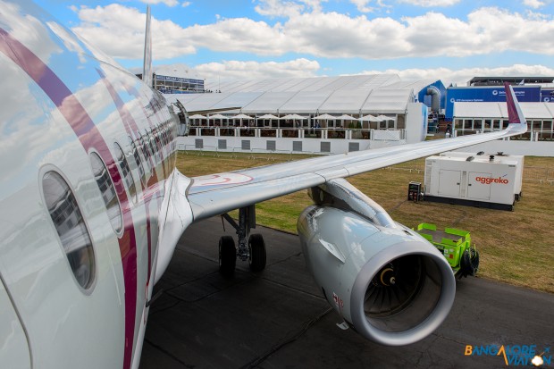 The fuselage of the super shiny A320 from the boarding ladder.