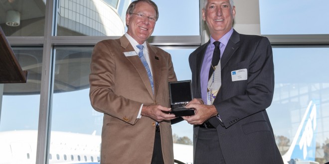 787 Vice President and General Manager Larry Loftis (right) hands the ceremonial keys over to The Museum of Flight President and CEO Doug King
