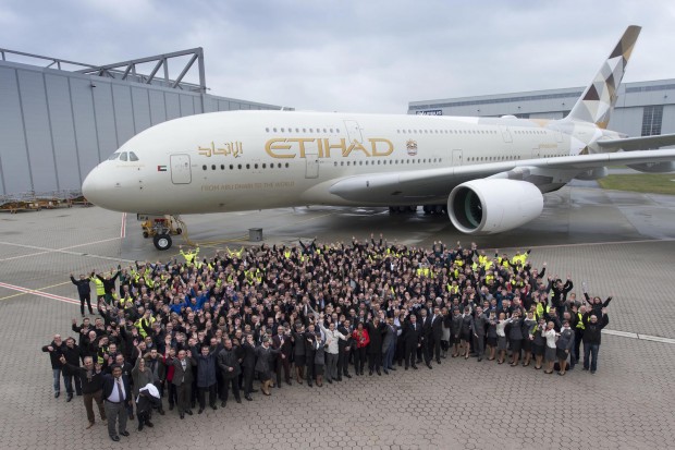 Airbus employees celebrate in Hamburg the handover of the first A380 to Abu Dhabi-based Etihad Airways. Airbus Image.