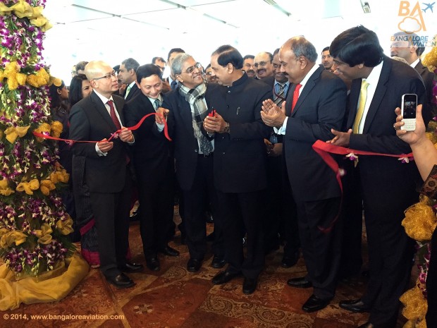 Dr. Mahesh Sharma, India's junior minister for civil aviation cuts the ribbon on Vistara (Tata-SIA airline) inaugural flight.