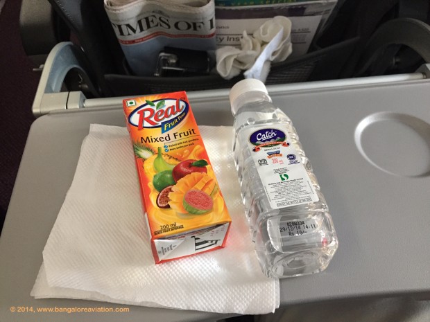 Vistara premium economy class lunch. Fruit juice and water.