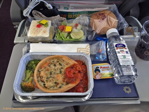 Vistara premium economy class lunch. Leek and prawn quiche with a sandwich and salad.