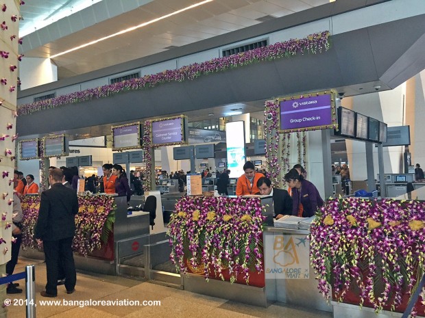 Vistara inaugural flight UK890 New Delhi to Mumbai. Check-in counters, decorated with orchids in the corporate purple colour.