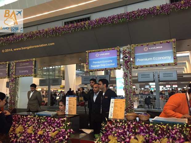 Vistara Premium Economy check-in counter decorated with expensive orchids for the inaugural flight.