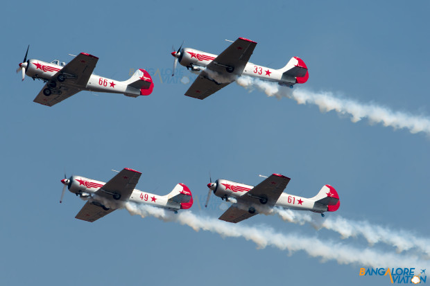 The Yakolevs performing their display. They fly three Yak-50 aircraft and one Yak-52.