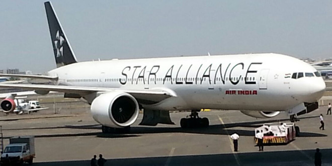 Air India Boeing 777-300ER VT-ALJ Bihar in special Star Alliance livery being wheeled out of the hangar.