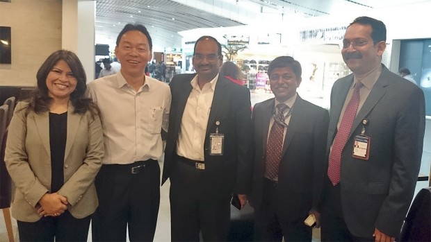 Vistara leaders G.M. Toh and Rashmi Soni with SGK Kishore, CEO, and other airport officials.