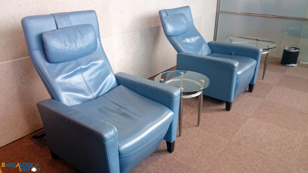 American Airlines Arrivals Lounge T3 London Heathrow. Recliners in the lounge.