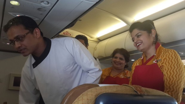 A chef interacting with passengers on one of the flights. Airline Image.