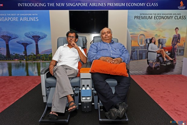 Devesh Agarwal along with another reporter in the Singapore Airlines premium economy class seat