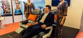 Singapore Airline's India country head David Lau demonstrates the new premium economy seat