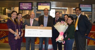 Vistara CEO Phee Teik Yeoh felicitates Biplove Choudhary as the one millionth passenger.