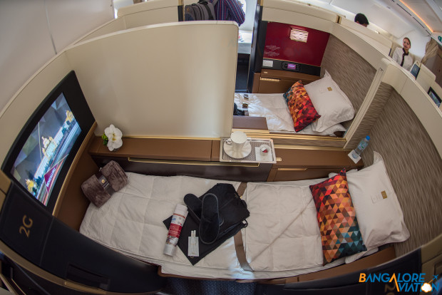 Suite 2D and 2G showing the lie flat bed after being turned down. Etihad First Class Boeing 787-9.