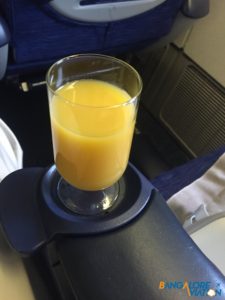 Glass of orange juice served in the first round of refreshments.
