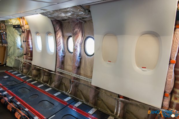 A view of the aircraft windows with the cladding that passengers usually see and without.