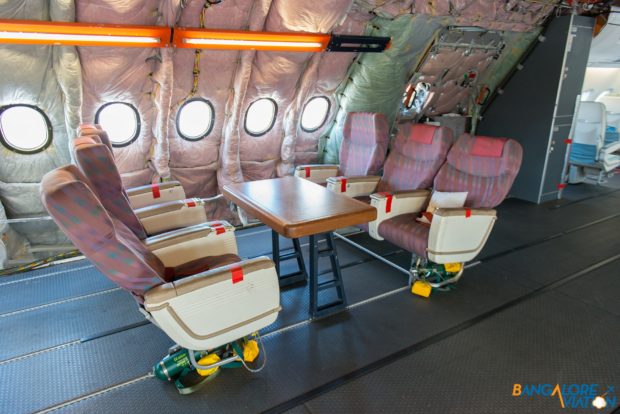 A small conference table on the upper deck of MSN 4, just aft of the cabin demonstration area.