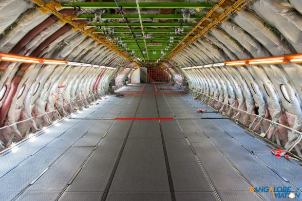 The upper deck of the A380 from next to the conference table looking towards the rear.