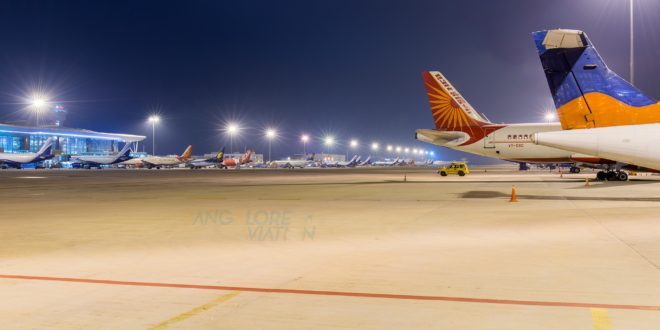 View of part of the ramp at Bangalore Airport at night.