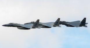 Two McDonnell Douglas F-15C Eagles with a McDonnell Douglas F-15E Strike Eagle.