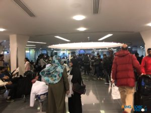 The crowded and unorganized terminal at Abu Dhabi airport.