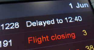 Delayed flights information board.